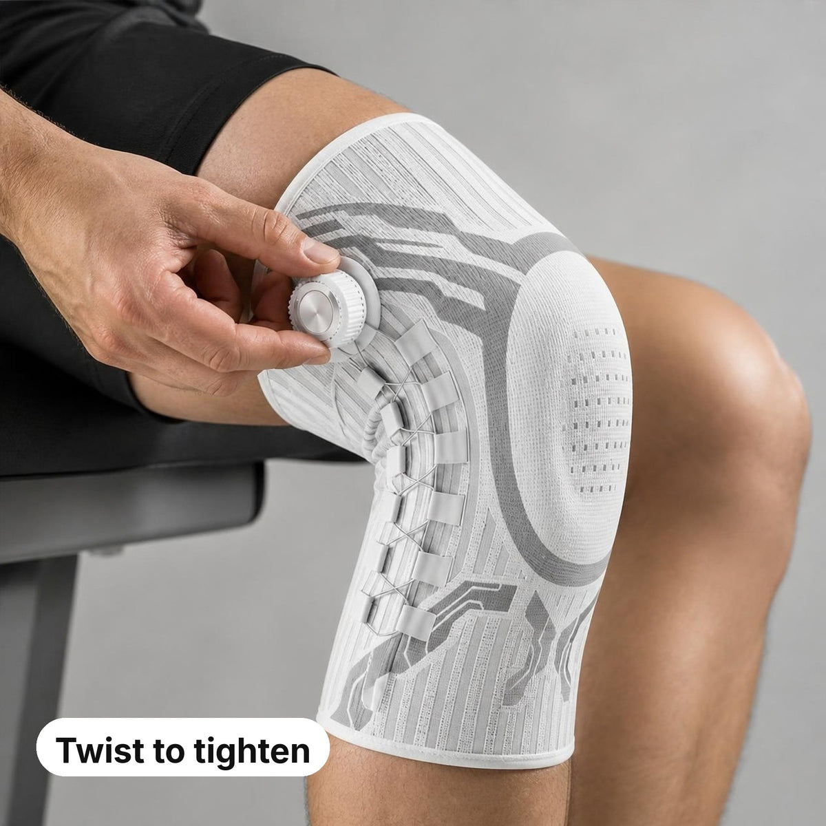 Hand turning the dial of the Magic Knee Brace to tighten it
